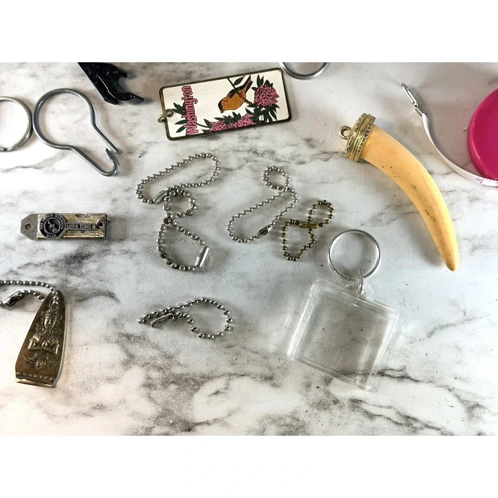 25 KEY RINGS ~BOTTLE OPENER, 150 LB CLIP, FIRE STARTER, BRACELET, ETC (3002)